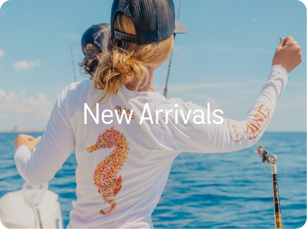 Woman wearing MANG Seahorse long sleeve shirt while fishing on the ocean 