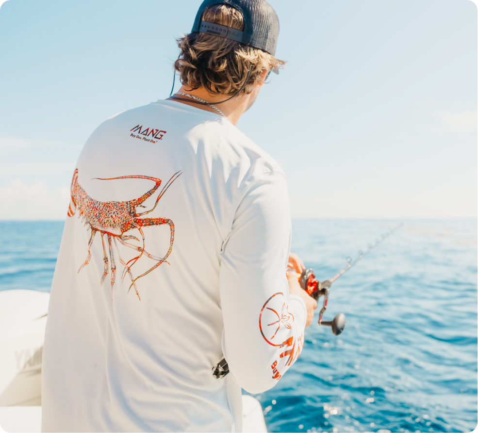Close-up of man fishing while wearing a MANG Lobster long sleeve shirt